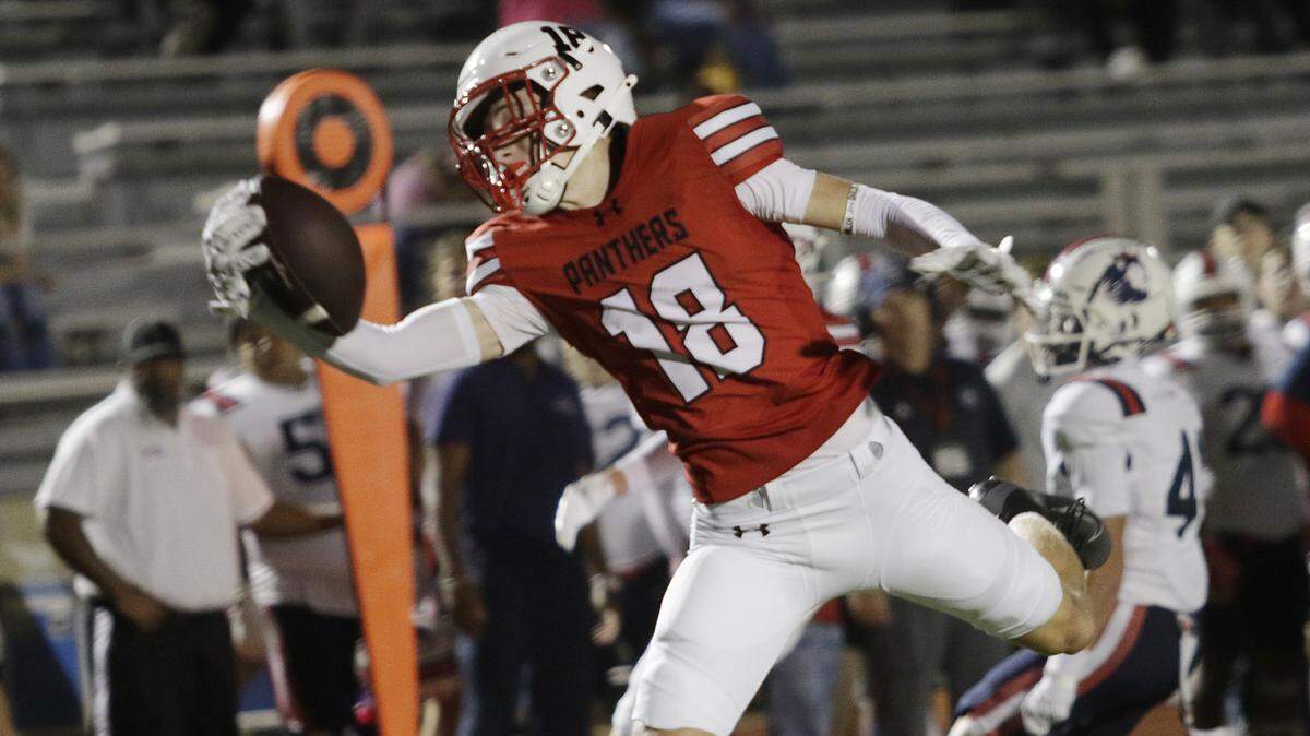 Colleyville Heritage’s Lucas Sunwall catches a touchdown pass against Richland during their Class 5A game Friday, Sept. 5, 2025, at Mustang-Panther Stadium.