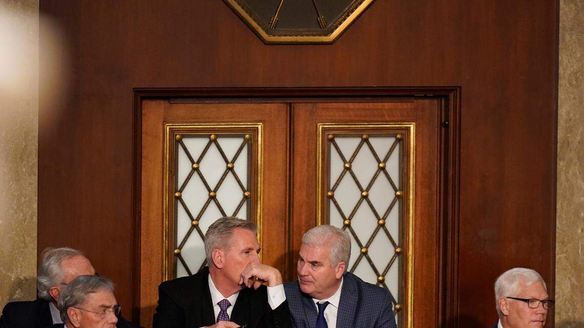 Rep. Kevin McCarthy, R-Calif., talks to Rep. Tom Emmer, R-Minn., during a sixth round of voting in the House chamber as the House meets for a second day to elect a speaker and convene the 118th Congress in Washington on Wednesday.