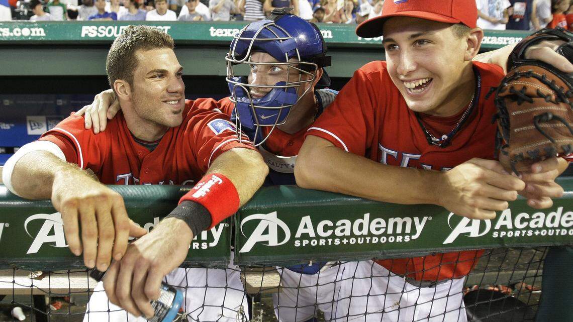 Chris Davis, left, and Derek Holland, right, rate as two of the best Rangers draft picks during Jon Daniels reign as general manager. They seemed to be amused by Josh Hamilton in his 2009 photo.
