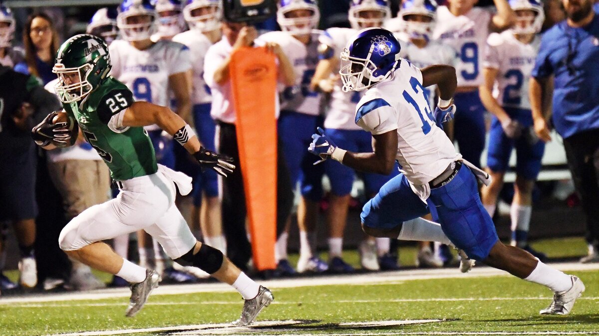 Azle’s Cody Akers, left races to the end zone for touchdown which gives the Hornets a 7-0 lead as Brewer’s Jahrad Taylor gives chase during the first quarter of Friday’s  October 26, 2018 football game at Hornet Stadium in Azle, Texas. Special/Bob Haynes