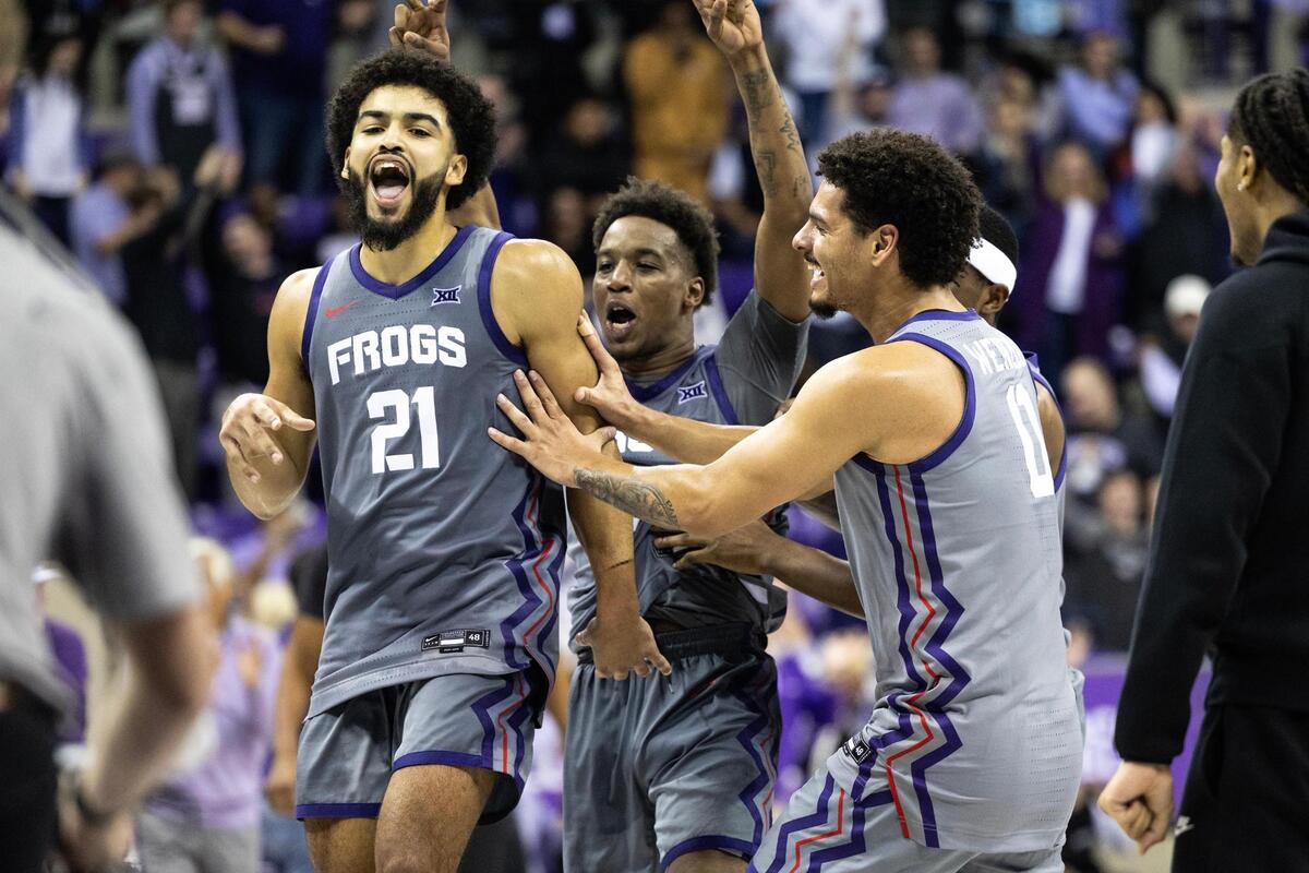 TCU guard Noah Reynolds (21) celebrates with his team after making the game-winning shot at the end of the second half of an NCAA game between TCU and Kansas State at Schollmaier Arena in Fort Worth on Saturday, Jan. 4, 2025.
