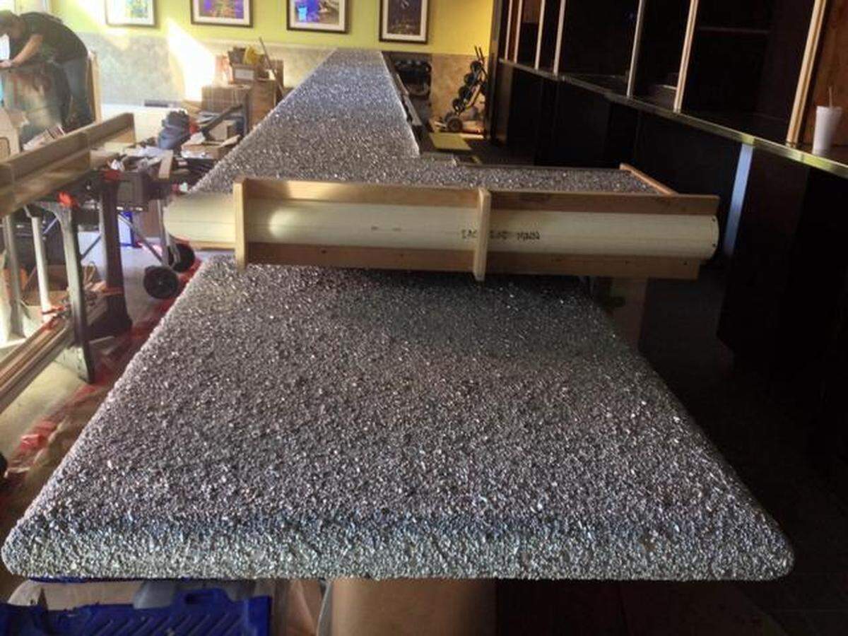 Before: The Bird Cafe bar was coated with birdseed before an epoxy sealant.