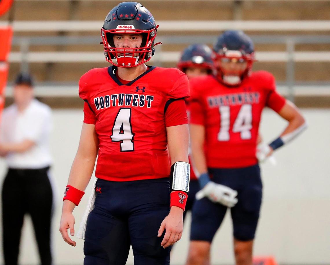 Northwest quarterback Jake Strong (4) and wide receiver Logan Jeskevic (14) check the sidelines for the play in the first half of a high school football game at Northwest ISD Stadium in Justin, Texas, Friday, Sept. 02, 2022. With 48 seconds remaining in the half Northwest took the lead ahead of McKinney North 13-10. (Special to the Star-Telegram Bob Booth)
