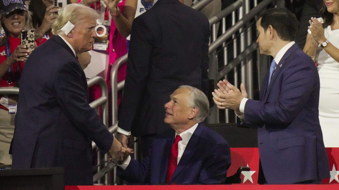 President Donald Trump (left) shakes hands with Texas Gov. Greg Abbott during the Republican National Convention in 2024. Trump reportedly urged Abbott to pursue redistricting in hopes of expanding the Republican majority in the U.S. House.