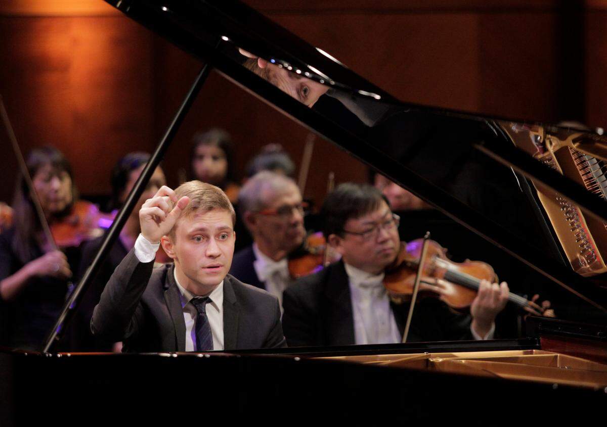 Dmytro Choni from Ukraine performs Prokofiev’s Piano Concerto No. 3 in C Major, op. 26 in the finals of the 16th Cliburn International Piano Competition in Bass Performance Hall in Fort Worth, Texas.