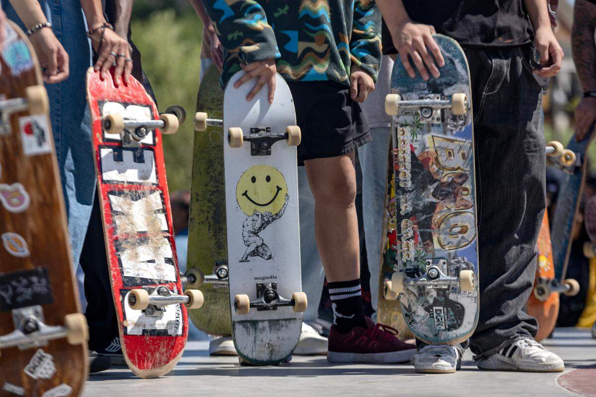 Skaters wait their turn to dive in at the top of the bowl in at the Dickies Skate Plaza in Fire Station Park on Saturday, April 29, 2023 in Fort Worth. The opening day event featured live music, food trucks and local vendors like Magnolia Skate Shop.