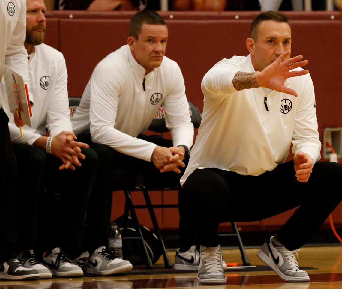 Birdville head coach Anthony Holman sends in a signal during the first half of the UIL 5A state semifinal playoff basketball playoff game at Lewisville High School in Lewisville Texas, Tuesday, Mar. 04, 2025.