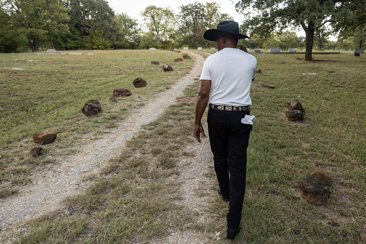 Jeff Pointer walks around Mosier Valley Ancestor Cemetery on Wednesday, Sept. 24, 2025. Pointer said this cemetery dates to the 1700s. It is reserved for Mosier Valley community members and their descendants.