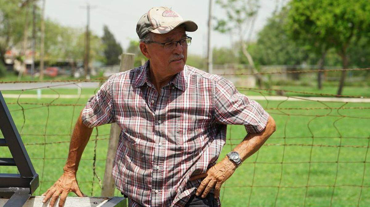 Jaime Portillo works on his property along U.S. Highway 281 in El Calaboz. Portillo’s property is divided by the border fence that runs along farmland in the Rio Grande Valley.