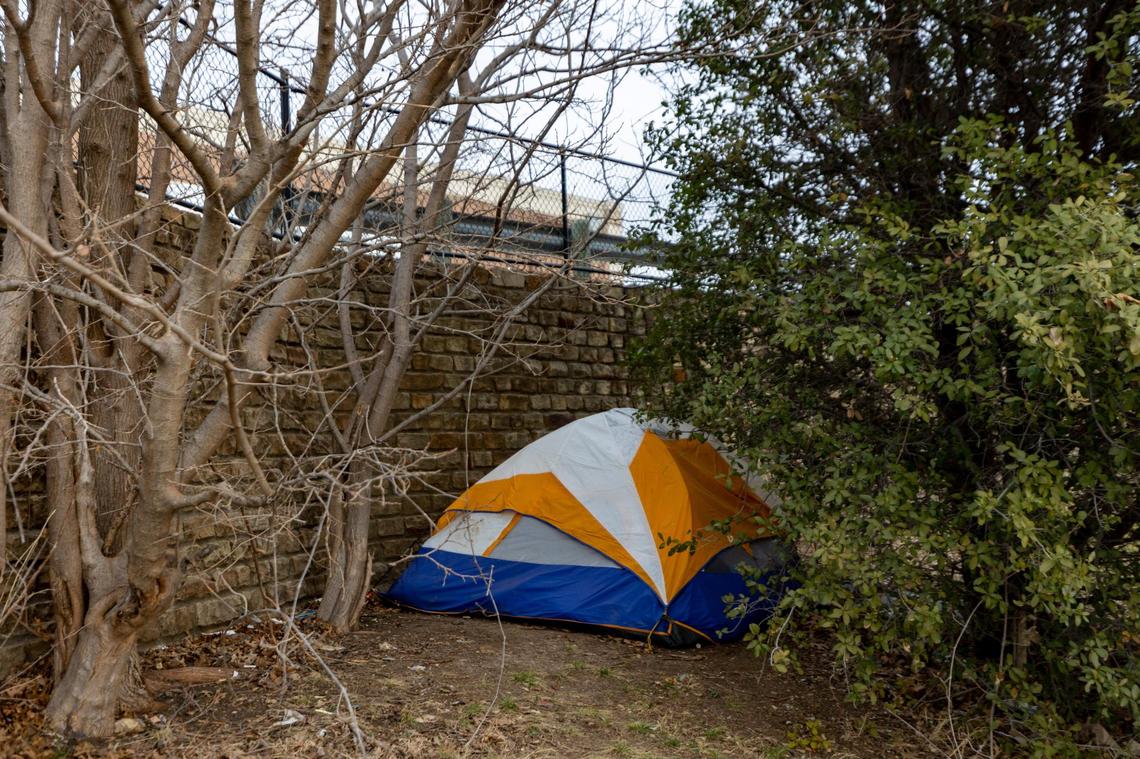 A tent is tucked beneath the ramp to a Super Target parking lot in Fort Worth.