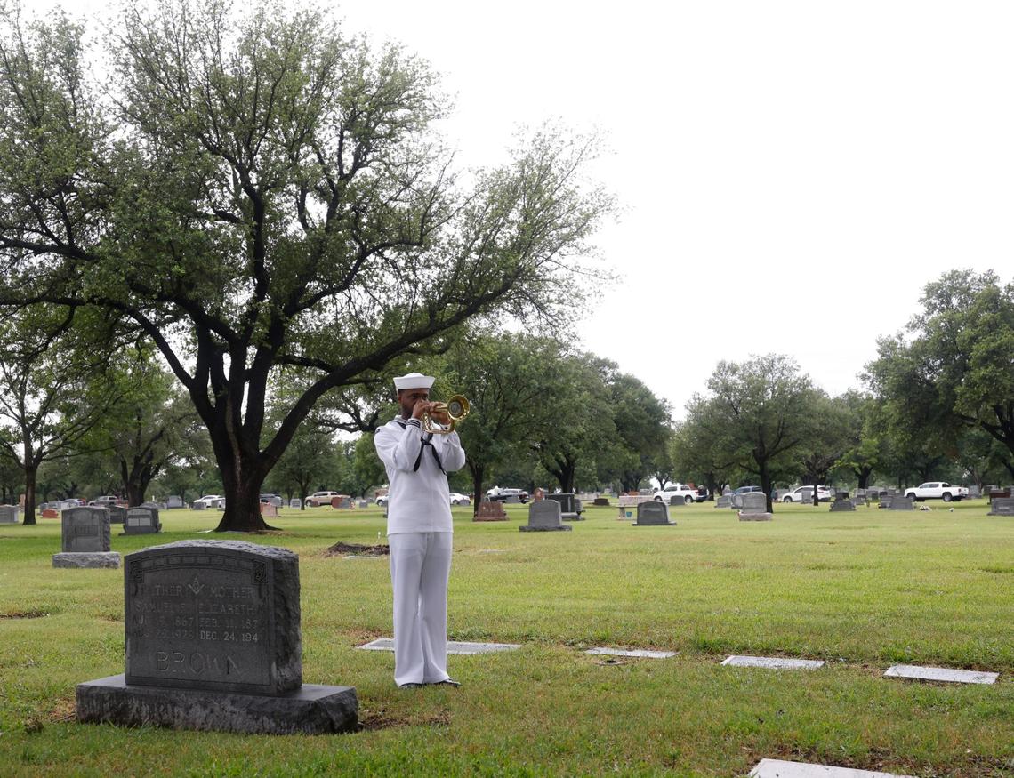 A lone Navy bugler played TAPS to conclude the 96th Fort Worth Memorial Day Service at Mount Olivet Cemetery in Fort Worth, Texas, Monday, May 26, 2025.