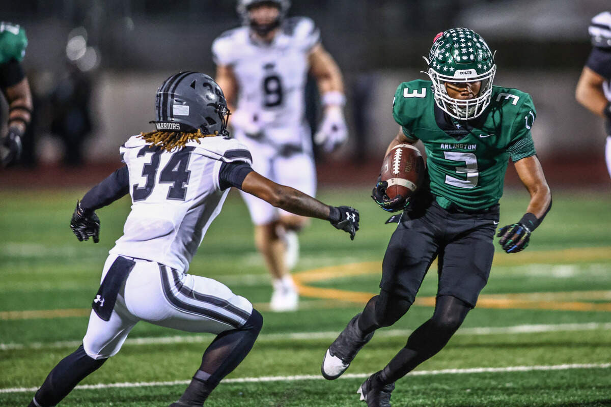 Arlington receiver Tayshaun Goston runs, trying to avoid Martin’s De’marius Hoye (34) at the Thursday, Nov. 7 game at UTA’s Maverick Stadium in Arlington. Special to the Star-Telegram / Tom Marvin