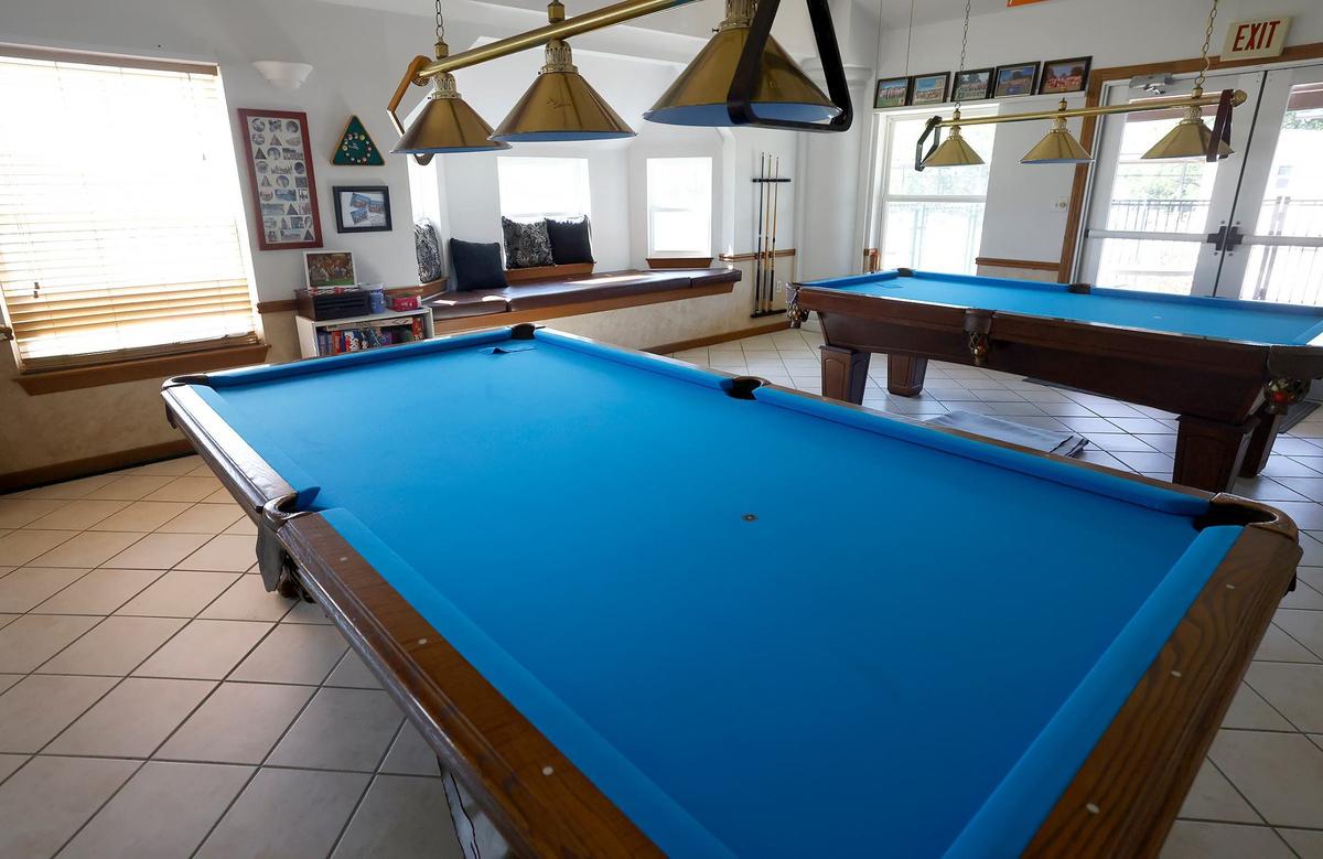 Wildwood Naturist’s Resort features a pool hall popular with guests and members on Friday, May 17, 2024, in Decatur. Wildwood is a nudist facility where guests and members can enjoy various amenities, like two swimming pools and wilderness trails, on 98 acres of land in North Texas.