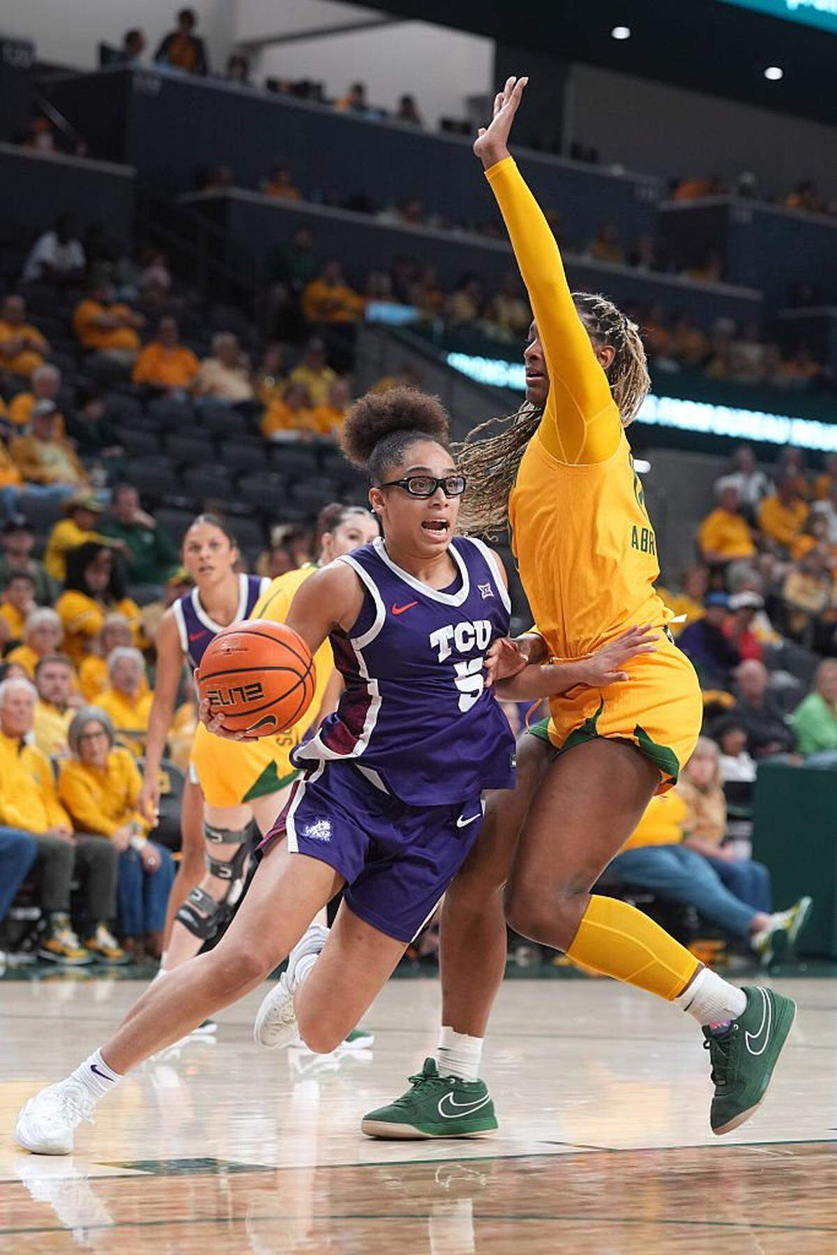 WACO, TEXAS - FEBRUARY 12: Olivia Miles #5 of the TCU Horned Frogs drives to the basket against Kyla Abraham #12 of the Baylor Bears during the second half at Foster Pavilion on February 12, 2026 in Waco, Texas. (Photo by Scott Wachter/Getty Images)