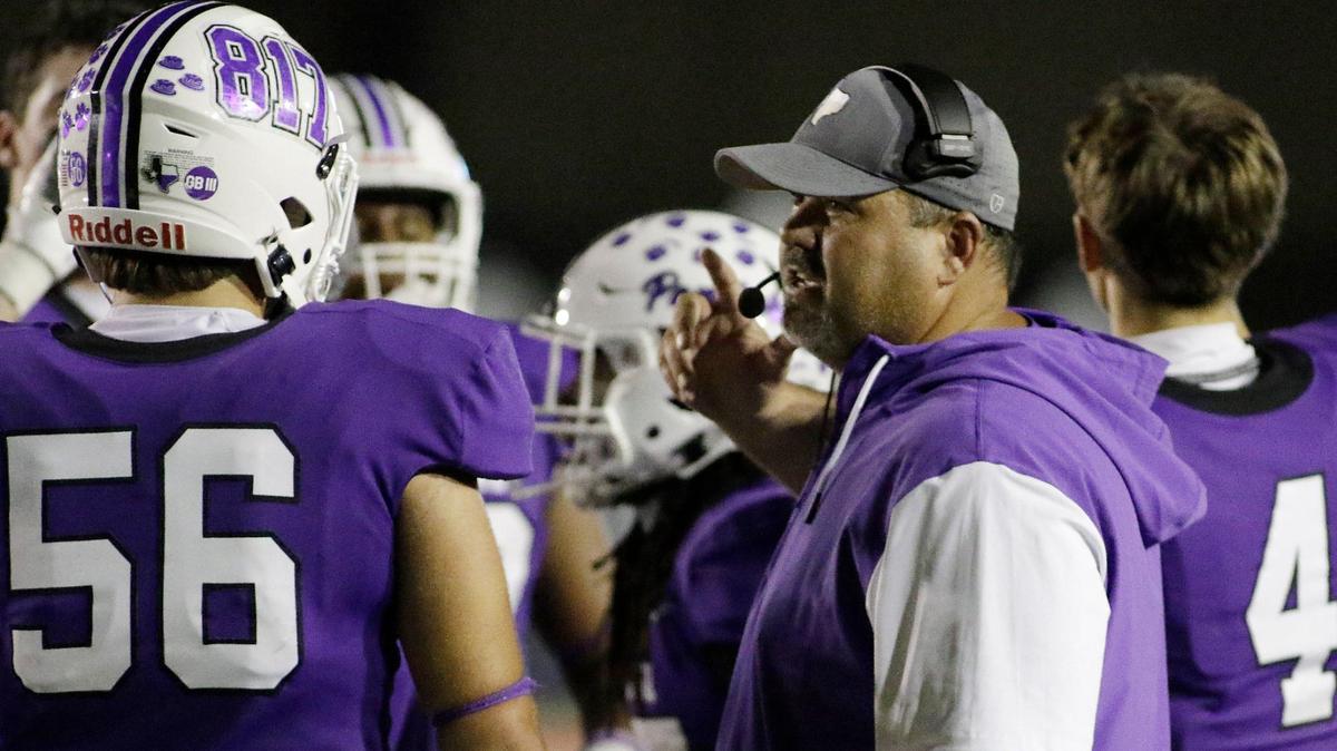 Pashal’s Head Coach John Killough talks with his team during a timeout at Farrington Field Stadium on Thursday, October 4, 2024.