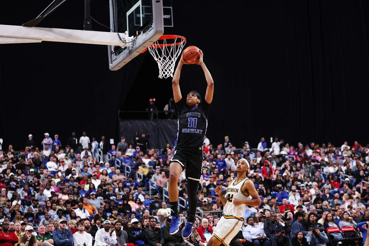 North Crowley forward Trey Hall goes up for a dunk in the Class 6A Division I state championship game against San Antonio Brennan on Saturday at the Alamodome in San Antonio.