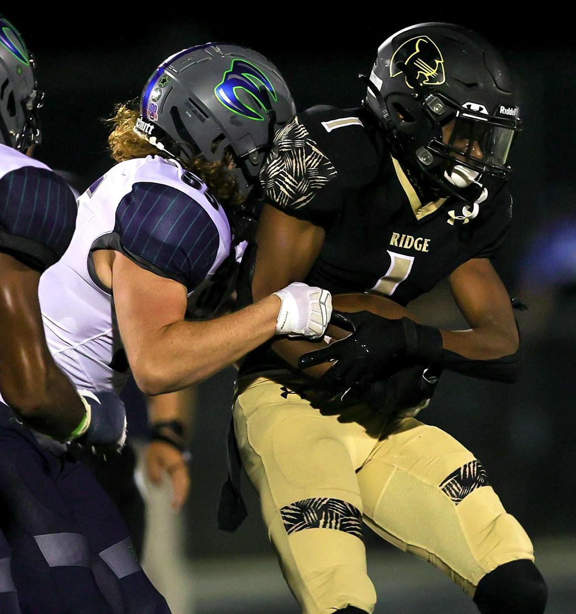 Keller Fossil Ridge running back Stephen Nnadozie (1) gets stopped by Eaton linebacker Brock Hayward (55) for a short gain during the first half of a high school football, October 22, 2020 played a Keller ISD Stadium in Keller, Tx. (Steve Nurenberg Special to the Star-Telegram)