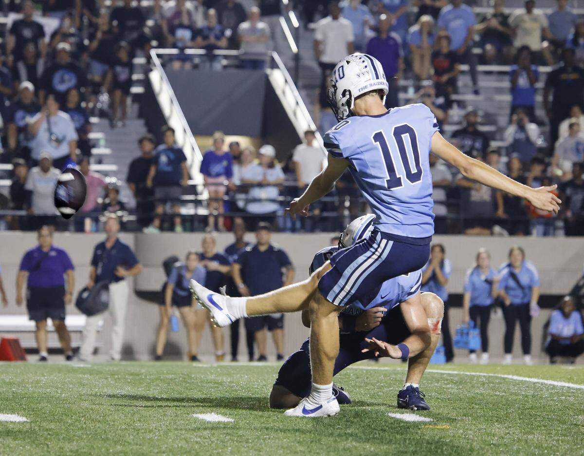 L.D. Bell kicker Grady Matcham (10) kicks the game winning field goal held by running back Brendon Gleim (22) during the first half of a UIL football game between Keller and L.D. Bell at Pennington Field in Bedford, Texas, Friday, Sept. 19, 2025.