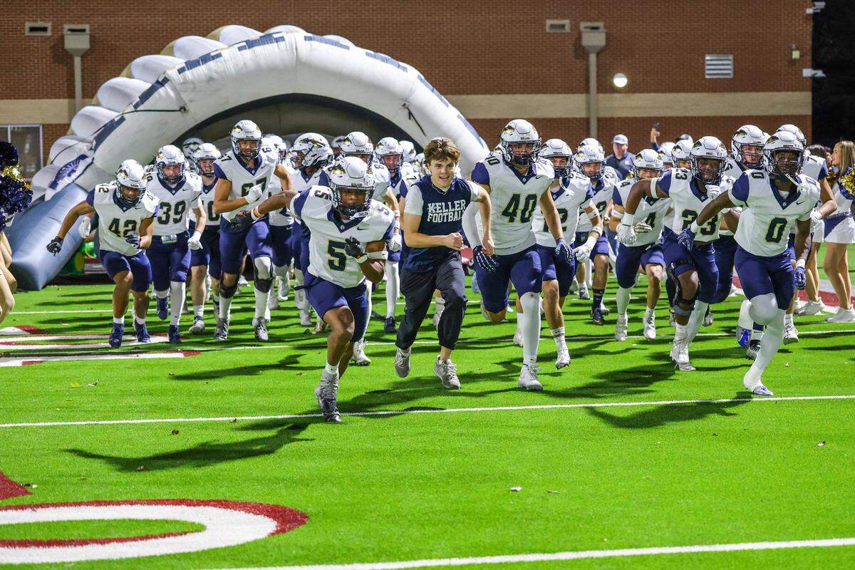 The Keller Indians take the field at Northwest ISD Stadium in Justin, Texas, Friday, Nov. 7, 2025.