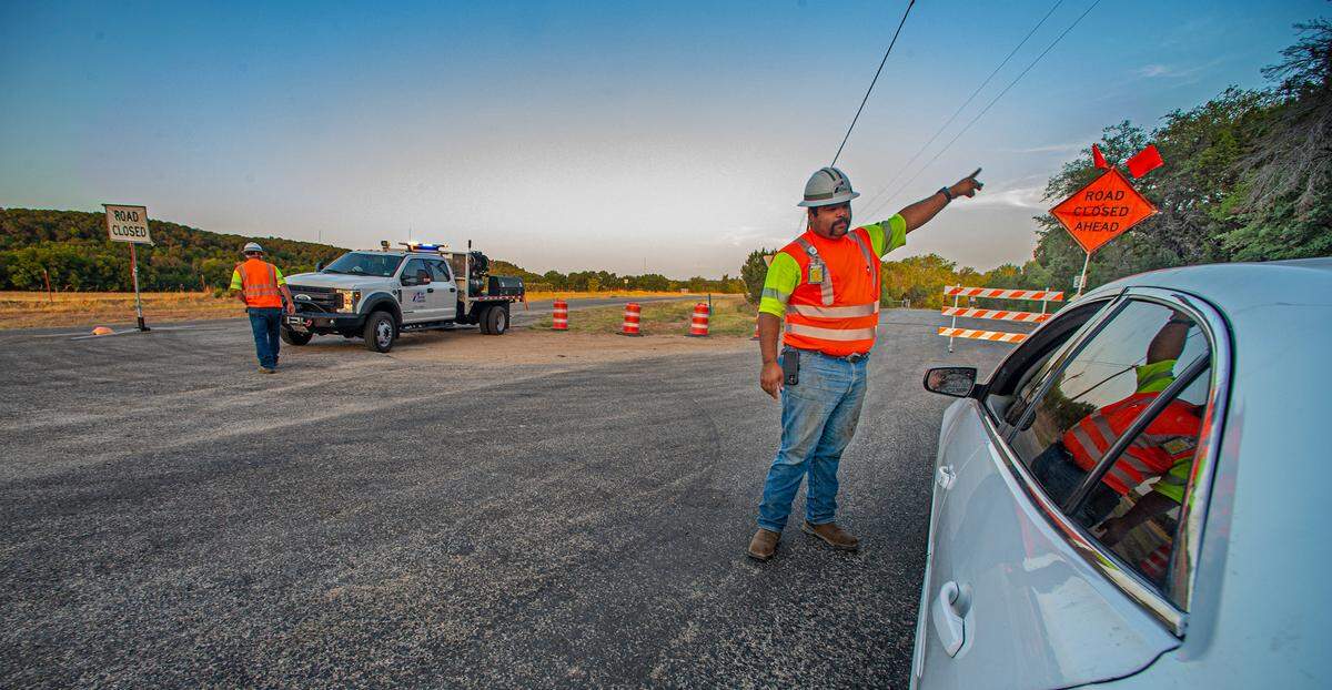 Somervell County workers turned motorists around on FM 205 in Glen Rose because of the Chalk Mountain fire on Wednesday, July 20, 2022.