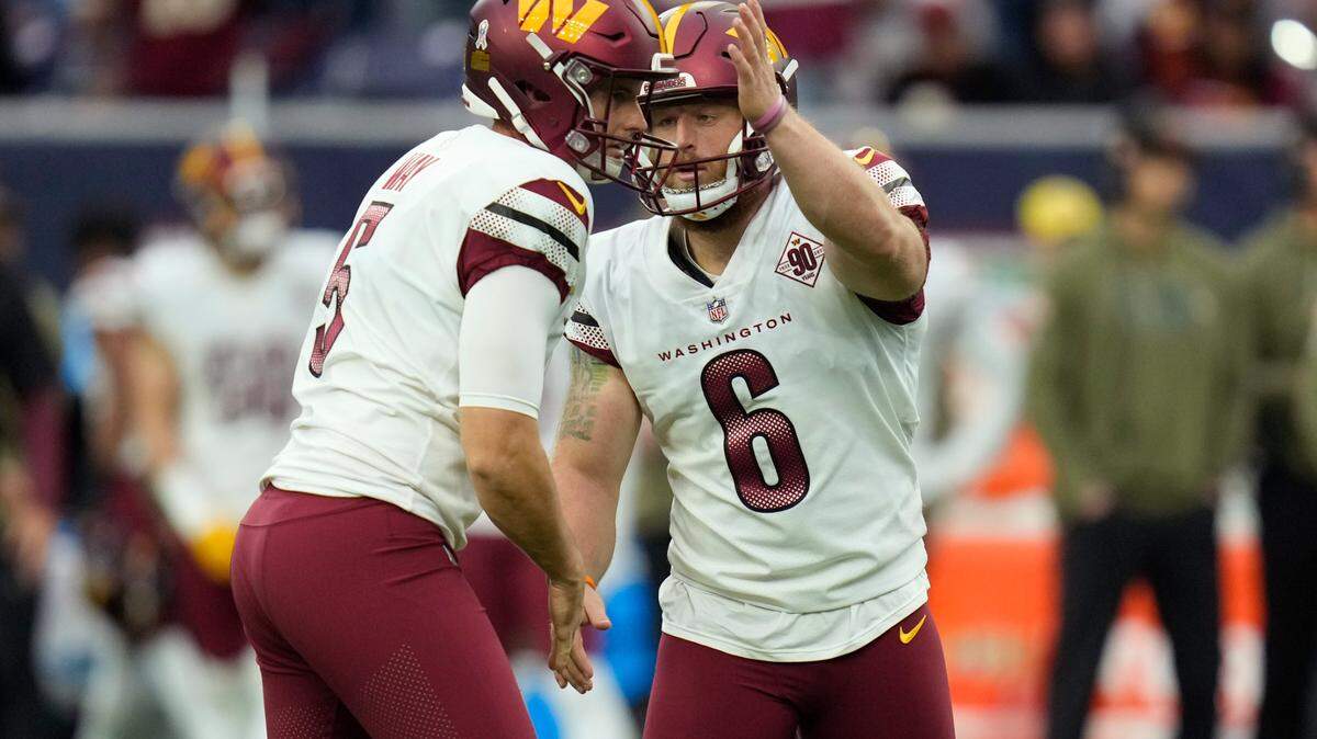 Washington Commanders place kicker Joey Slye (6) celebrates his field goal with punter Tress Way (5) during the second half of an NFL football game against the Houston Texans Sunday, Nov. 20, 2022, in Houston. (AP Photo/Eric Christian Smith)