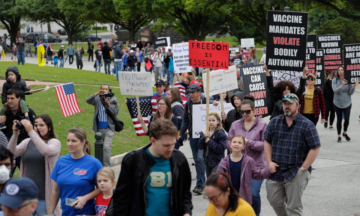 Protesters rally at the Texas State Capitol to speak out against Texas’ handling of the COVID-19 outbreak, in Austin, Texas, Saturday, April 18, 2020. Austin and many other Texas cities remain under stay-at-home orders due to the COVID-19 outbreak except for essential personal. (AP Photo/Eric Gay)