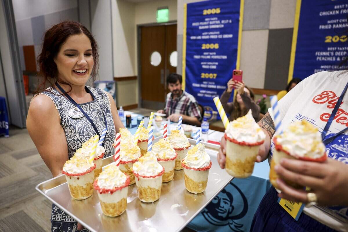 Corn Flake Shappé is passed out during the Big Tex Choice Awards on Tuesday, Aug. 18, 2026 in Dallas. The dessert blends toasted corn flakes with dulce de leche, buttery Texas pecan notes and a blend of warm spices. It is topped with whipped cream, corn flake crunch, strawberry crumble and a dusting of powdered sugar.