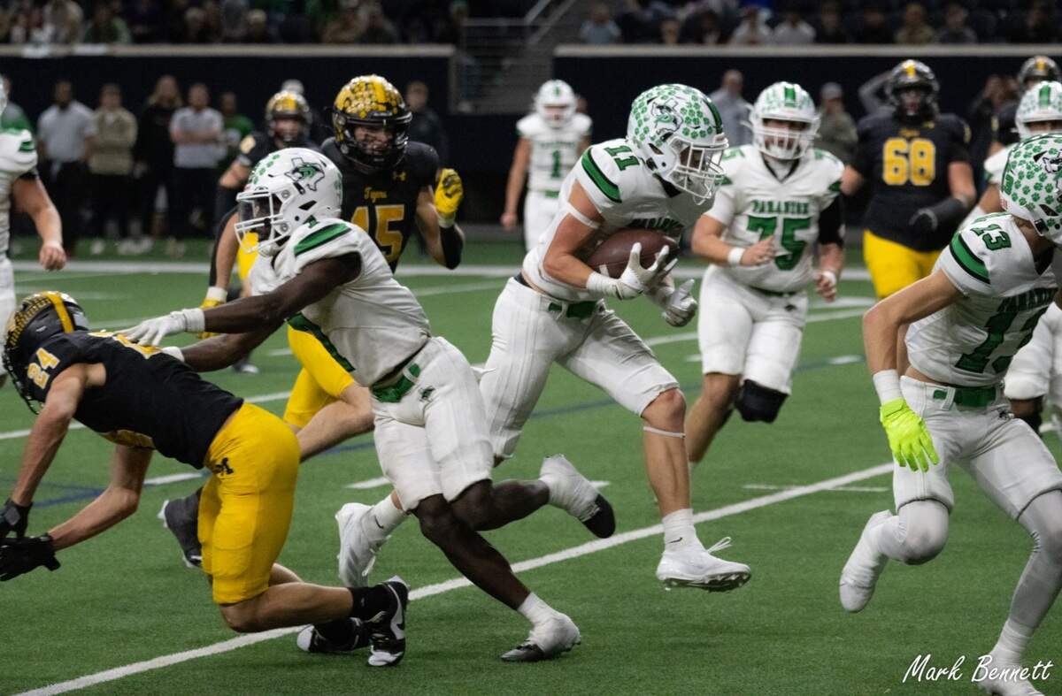 Paradise running back Luke Brown hits the hole against Malakoff in a Class 3A Division 1 state quarterfinal on Thursday, Dec. 12, 2024 at the Ford Center in Frisco, Texas.