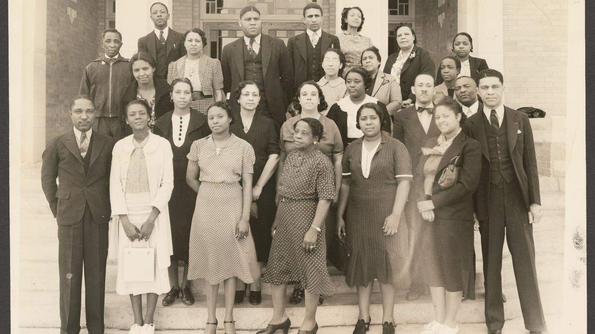 I. M. Terrell High School faculty on the steps of the newly-opened school building during the late 1930s.