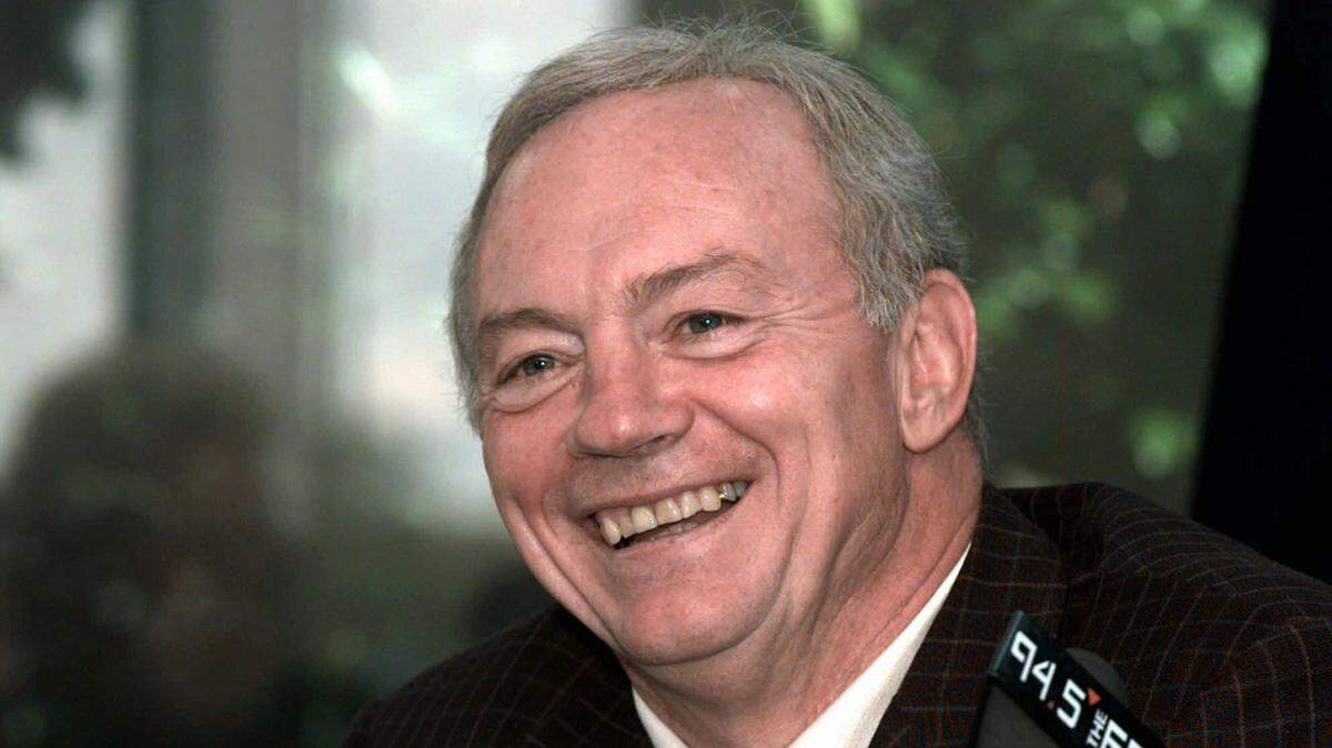 Dallas Cowboys owner Jerry Jones laughs during a press conference in October 1996. He has been sued by a woman, 25, who says he is her biological father.