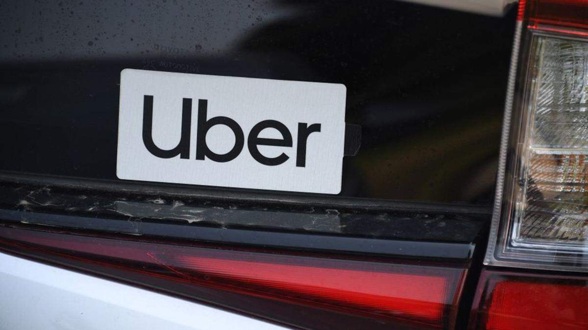 An Uber sticker is seen on a car at the start of a protest by ride share drivers on August 20, 2020 in Los Angeles, California.