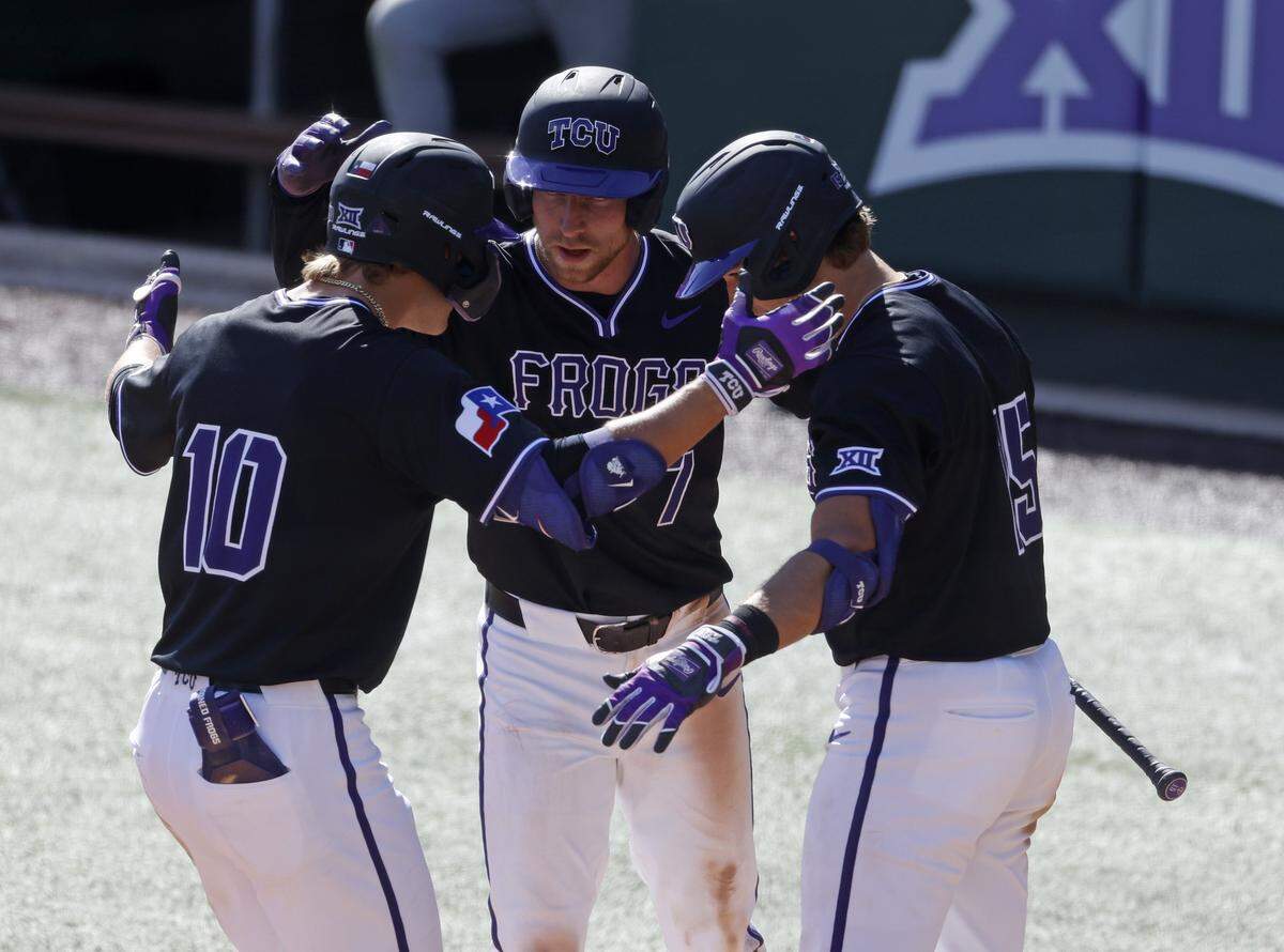 TCU infielder Cole Cramer (7) and outfielder Chase Brunson (15) celebrate with outfielder Sawyer Strosnider (10) after Stronsnider scored during an NCAA baseball game against New Mexico at Lupton Field at TCU in Fort Worth, Texas, Tuesday, March, 17, 2026.