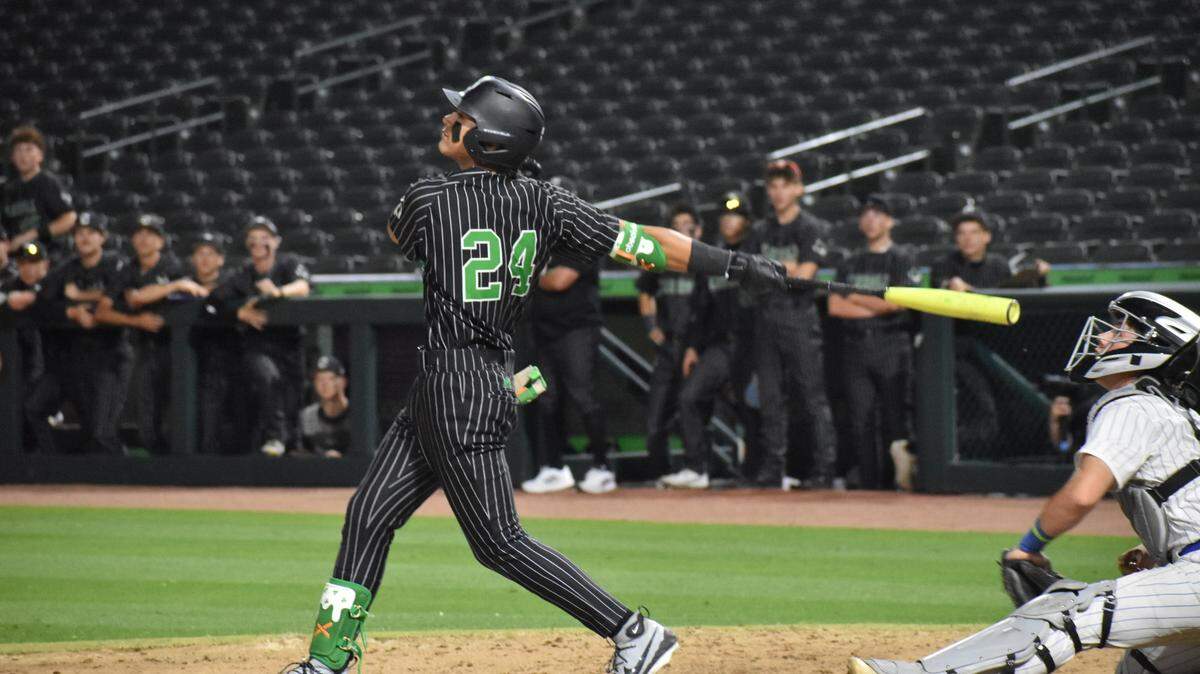 Southlake Carroll’s Grayson Olivo takes a swing in a area round playoff game at Riders Field in Frisco on Friday, May 9, 2025.