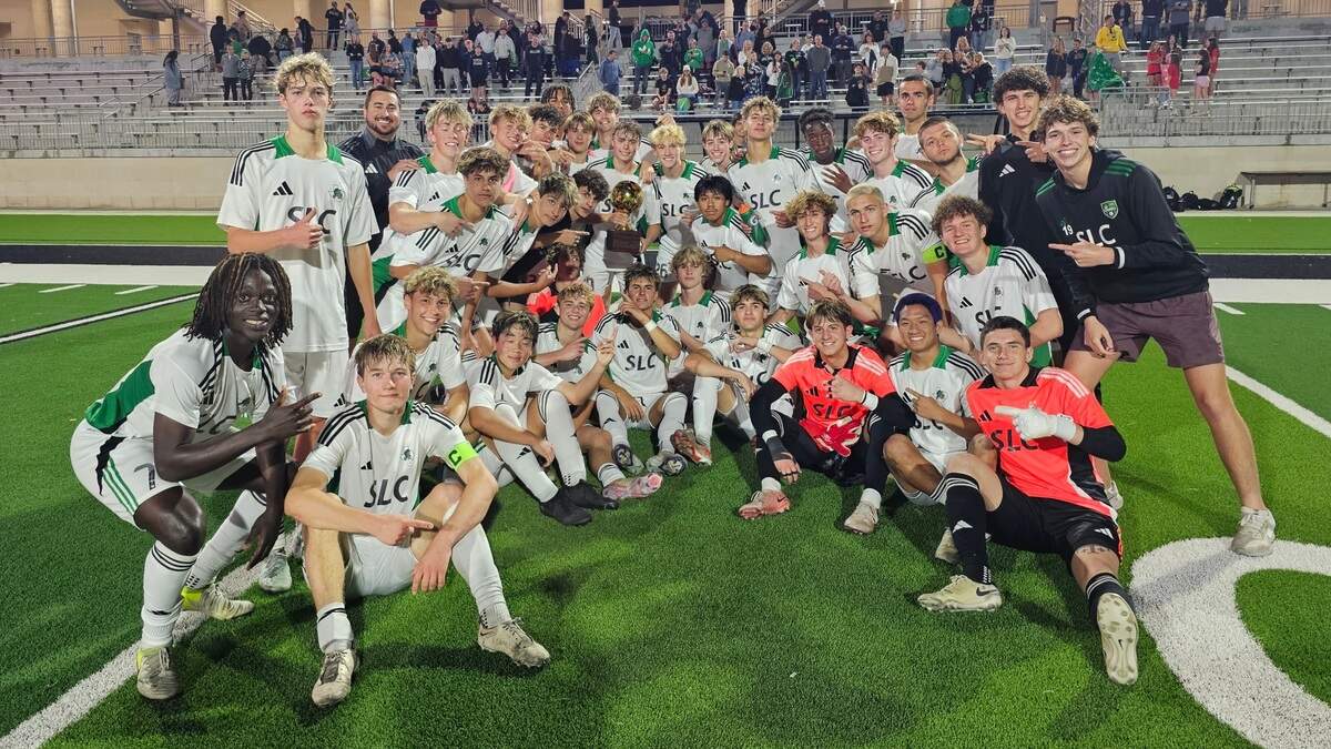 The Southlake Carroll boys soccer team poses with the trophy after defeating Haltom in a Class 6A Division 2 regional semifinal on Friday, March 28 at Crowley ISD Multi-Purpose Stadium in Fort Worth, Texas. Carroll won 3-1.