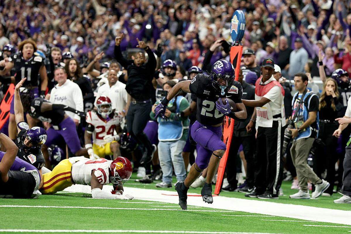 SAN ANTONIO, TEXAS - DECEMBER 30: Jeremy Payne #26 of the TCU Horned Frogs scores the final touchdown of the game during overtime against the USC Trojans at Alamodome on December 30, 2025 in San Antonio, Texas. (Photo by Kenneth Richmond/Getty Images)