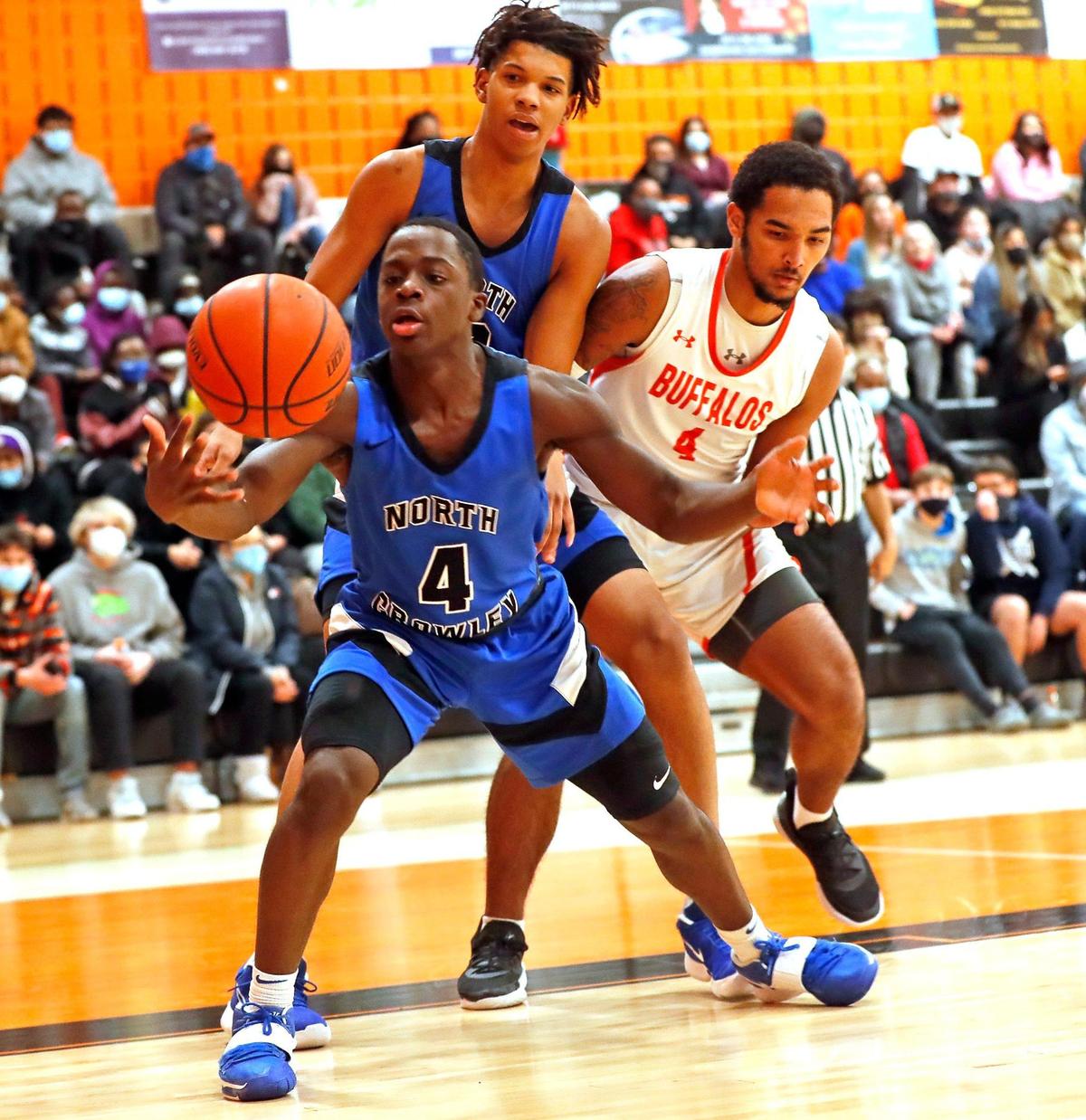 North Crowley guard Remon Tuck (4) grabs a rebound under Haltom’s net during a District 3-6A Bi-district basketball game at Haltom High School in Haltom City, Texas, Friday, Feb. 12, 2021. North Crowley defeated Haltom 55-45. (Special to the Star-Telegram Bob Booth)