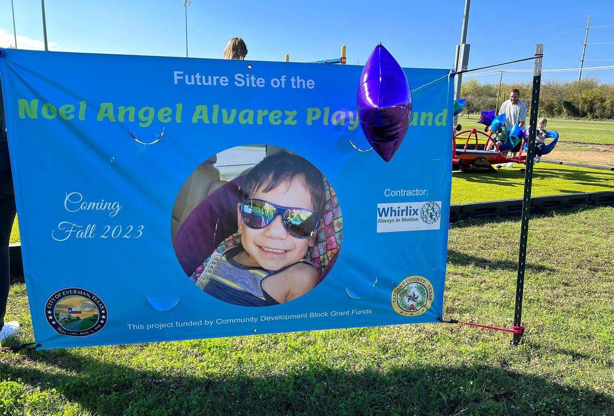 A banner welcomes community members to Noel Angel Alvarez Playground at Clyde Pittman Park in Everman on Monday, November 20, 2023. The playground, built to accommodate children with disabilities, was dedicated to a local 6-year-old who was first reported missing in March.