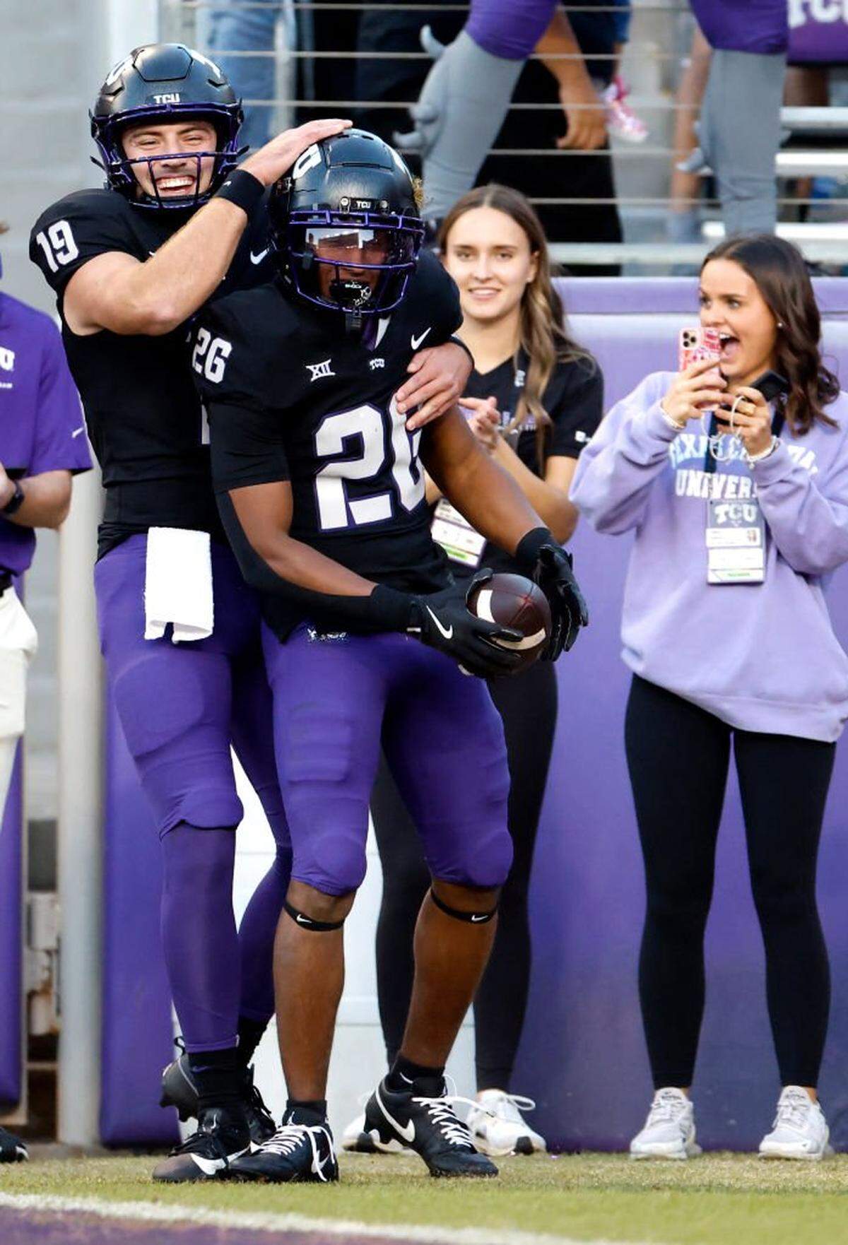 FORT WORTH, TX - NOVEMBER 23: Ken Seals #19 of the TCU Horned Frogs and teammate Jeremy Payne #26 celebrate a touchdown against the Arizona Wildcats during the second half at Amon G. Carter Stadium on November 23, 2024 in Fort Worth, Texas. (Photo by Ron Jenkins/Getty Images)