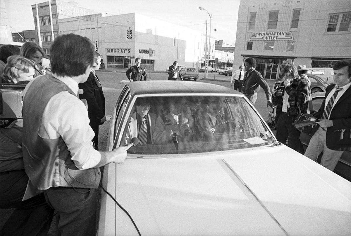 Candace (Candy) Montgomery with husband Pat inside of a car, leaving the old Collin County Courthouse after a jury acquitted her.