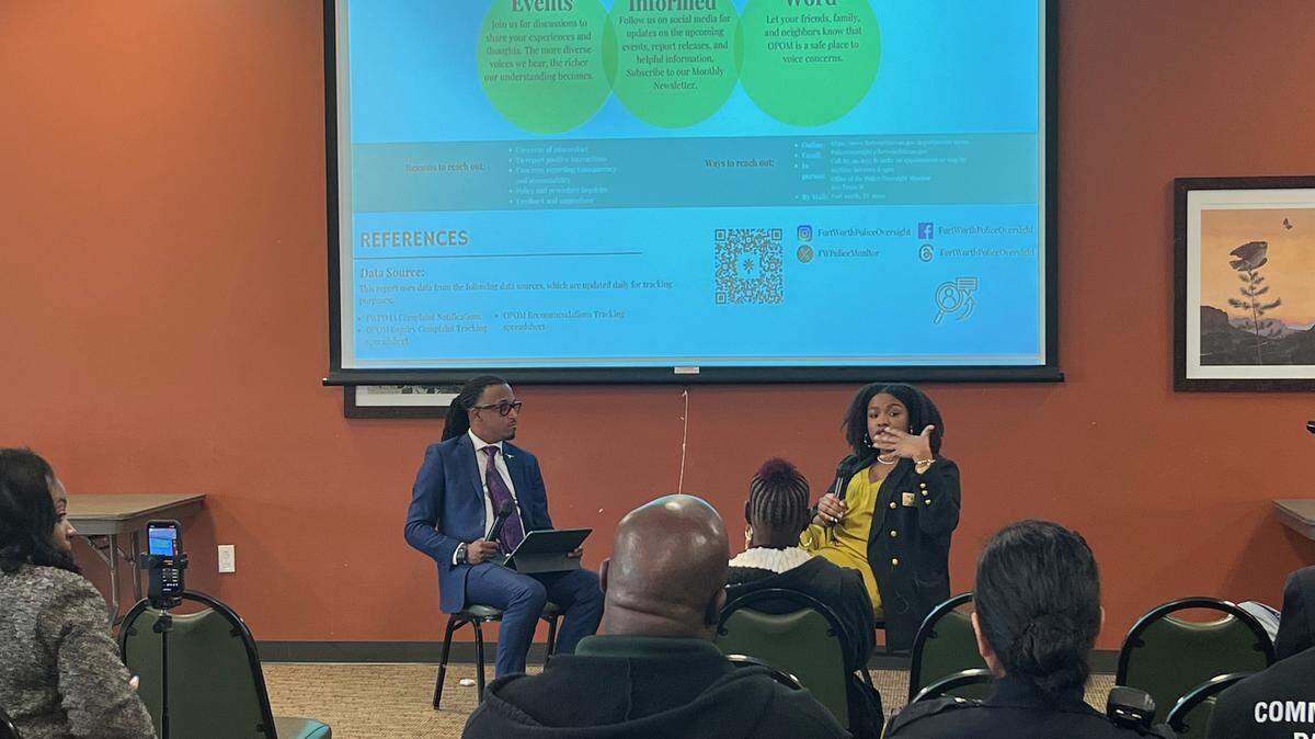 City Councilmember Chris Nettles, left, and director of the Office of the Police Oversight Monitor Bonycle Sokunbi, right, host a presentation on the role of the Office of the Police Oversight Monitor and the new Community-Police Mediation Program at Lou’s Place, 1112 Wesleyan Street, on Tuesday, March 26, 2024.