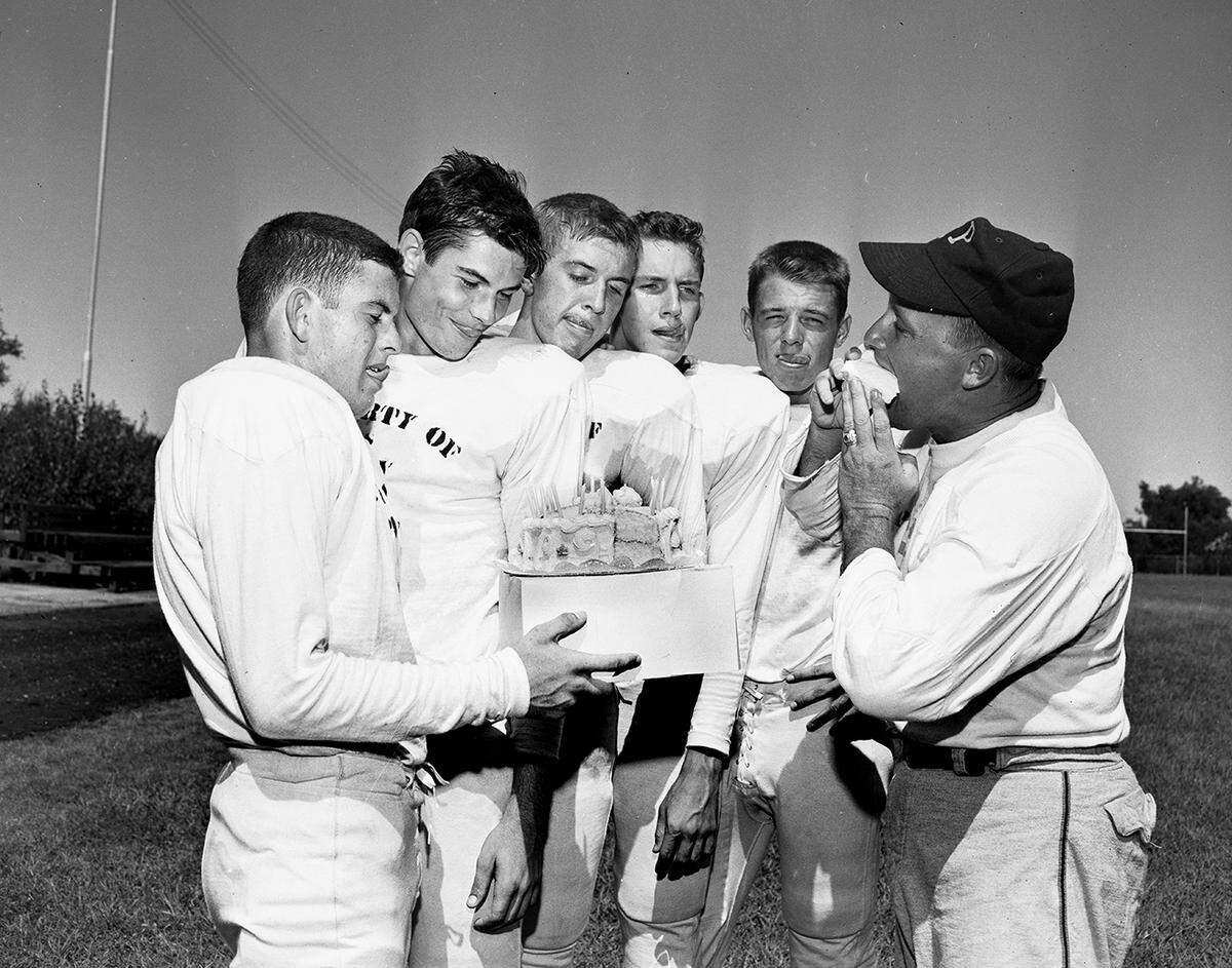 Aug. 27, 1951: When admirers came up with a birthday cake for Poly’s Paul Wilson, third from left, at football practice, Assistant Coach Preston Thompson thought it was a fine idea. He ate the cake while the grid men, on a training diet, looked on hungrily. Left to right are Jim Brock and Bill Enis, backs: Wilson, a center; Don Leaman and Bill Estill, ends, and Thompson.
