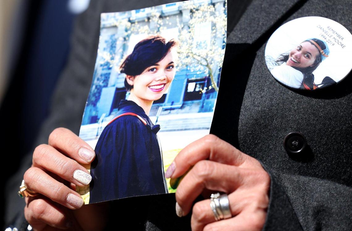 Clariss Moore holds a photograph of her daughter, Danielle Moore, outside of the federal courthouse in downtown Fort Worth on Thursday, January 26, 2023. Danielle Moore was killed in one of the plane crashes involving a Boeing 737 MAX jet. She attended an arraignment challenging the plea agreement Boeing made with the Justice Department that granted them immunity from criminal prosecution.