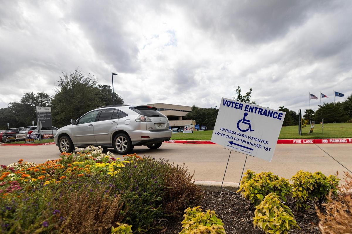 A car drives into the voting site for early voting at the Tarrant County Sub-courthouse in Mansfield on Wednesday, Oct. 30, 2024.