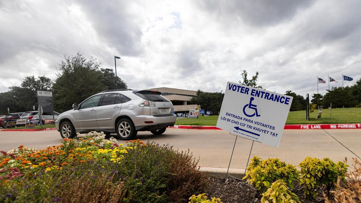 A car drives into the voting site for early voting at the Tarrant County Sub-courthouse in Mansfield on Wednesday, Oct. 30, 2024.