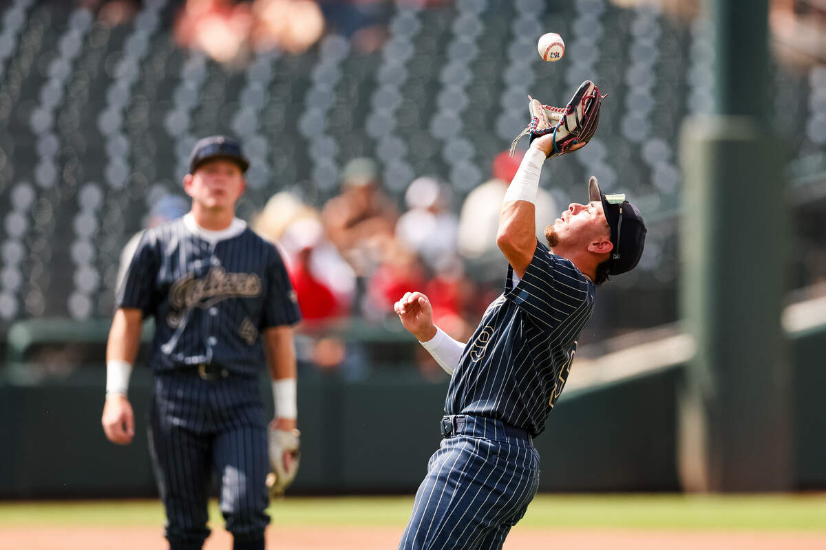 Keller second baseman Maximus Segura, right, handles a pop fly against Austin Lake Travis as third baseman Jayden Moeller, left, looks on in the UIL Class 6A Division I baseball state championship game on Saturday, June 6, 2026, at Dell Diamond in Round Rock, Texas.