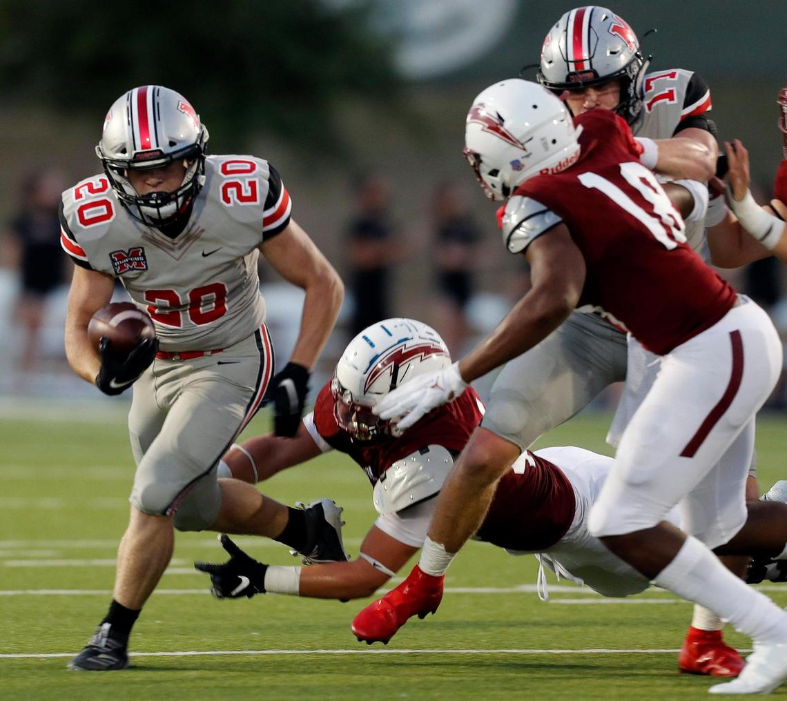 Marcus running back Walker Wells (20) slips out on the right side of the line during a high school football game at Keller ISD Stadium in Keller, Texas, Thursday, Oct. 08, 2020. Keller Central lost their homecoming game to Flower Mound Marcus. (Special to the Star-Telegram Bob Booth)