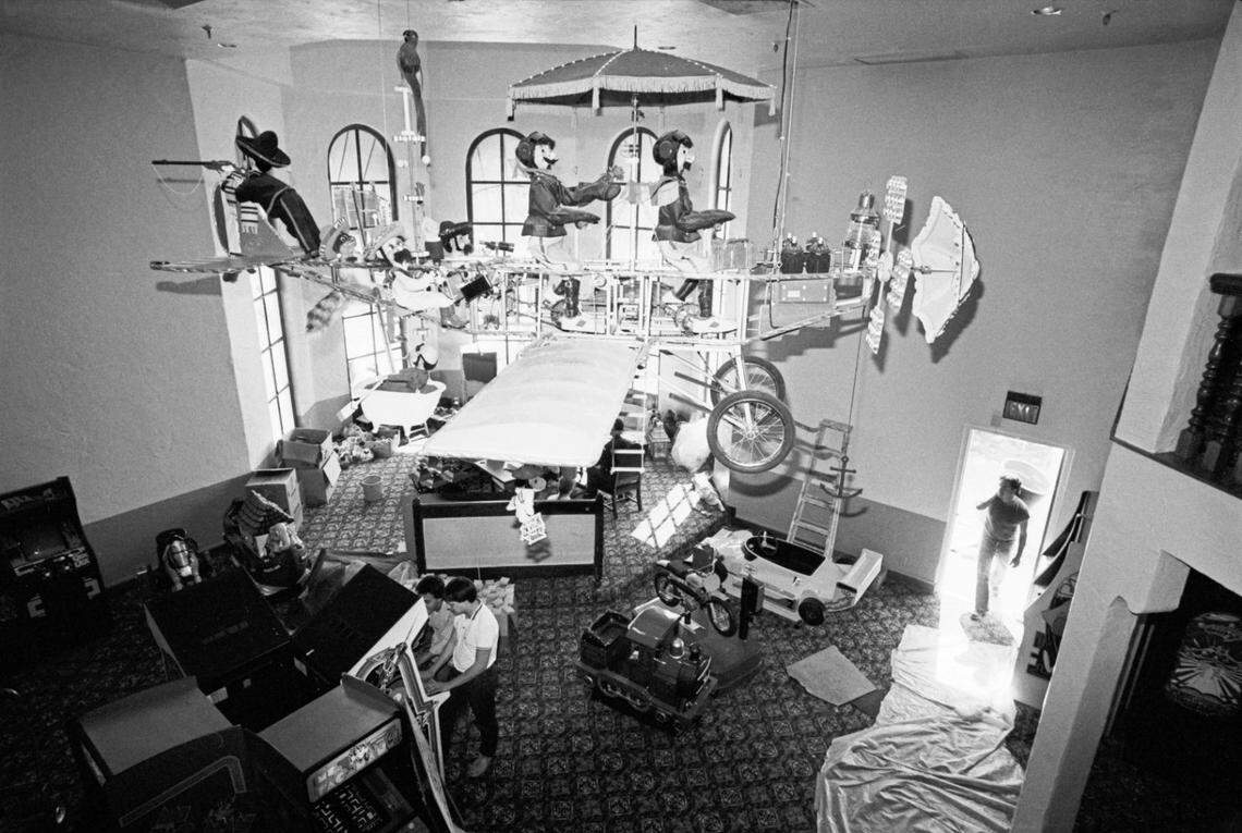 May 21, 1982: A whimsical flying machine above a game room under construction at Casa Bonita, a multi-level Mexican-style buffet restaurant in Fort Worth. Two people are seen playing on the arcade console at bottom center. (The location today near I-20 behind Hulen Mall is near a Rooms To Go outlet.)