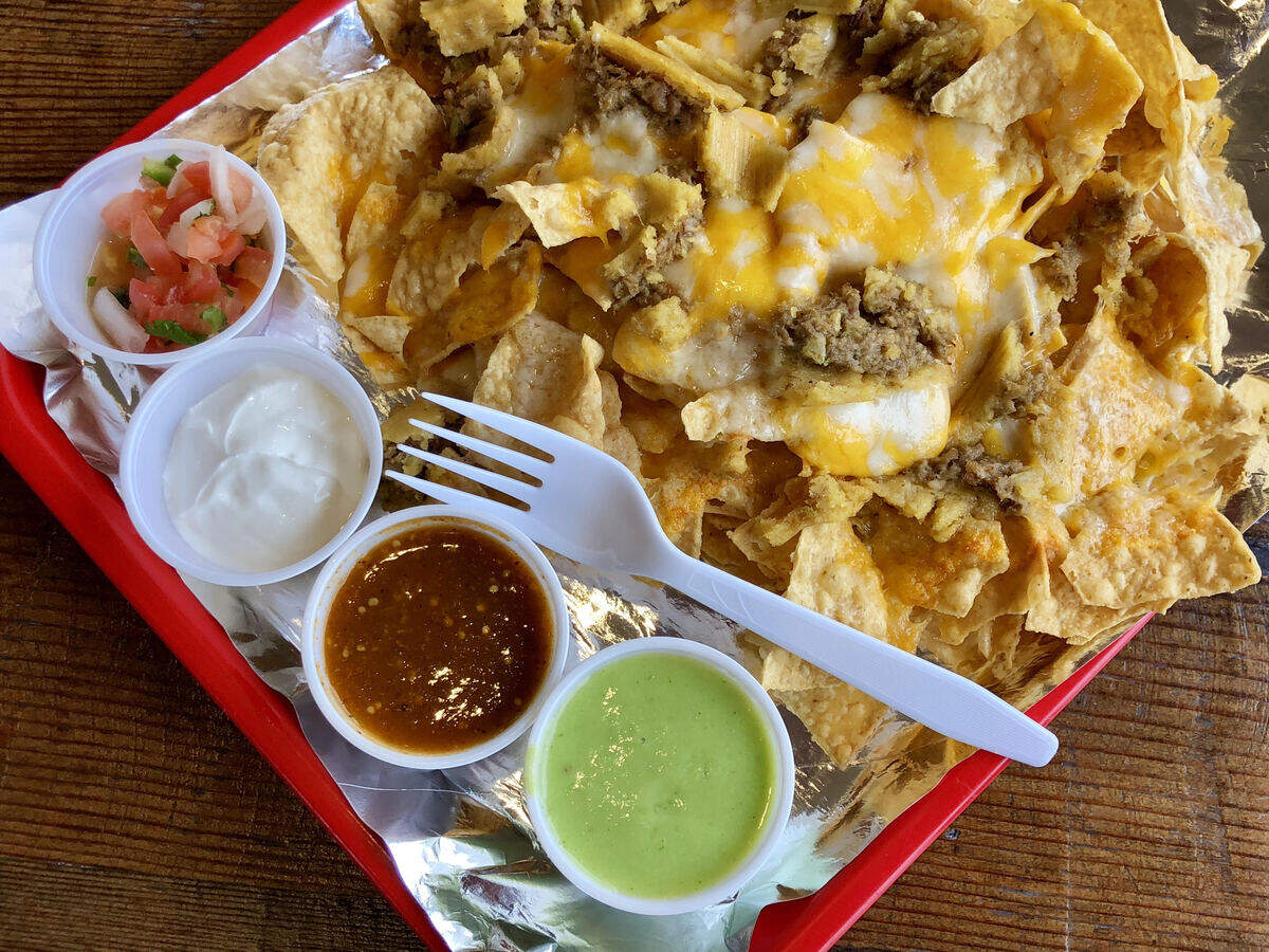“Tamale nachos” at Tommy Tamale feature — well, tamale bites on chips with cheese and salsa