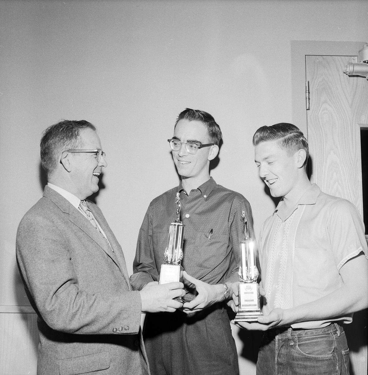 Feb. 16, 1959: Charles H. Dobbs, sponsor of Paschal High bowling team, presents trophies to John Brutschet, center, and David Lusby. The boys finished in sixth place in the American Junior Bowling Congress national doubles competition.
