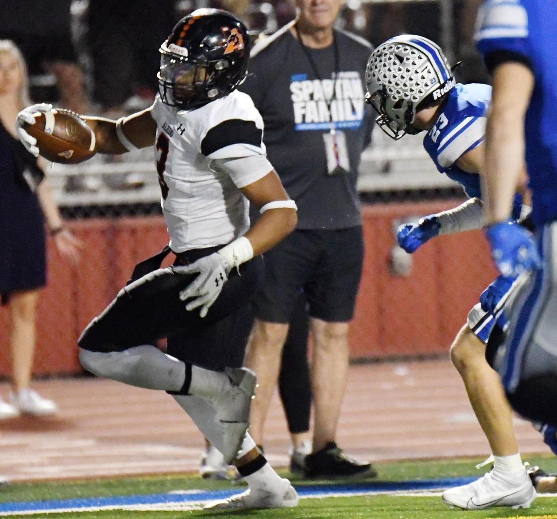 Aledo’s Davhon Keys, left runs up the sideline past Centennial’s Ben Meyer into the endzone for the touchdown to take a 48-21 lead in the fourth quarter of Friday’s October 14, 2022 District 3-5A Division 1 football game at Burleson ISD Stadium in Burleson, Texas. Aledo went on to win 64-21. Special/Bob Haynes